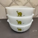 Five Vtg Anchor Hocking Fire Bc Johnny Hart Crog Cereal Bowls Dinosaurs. Fixed Price $45.00.